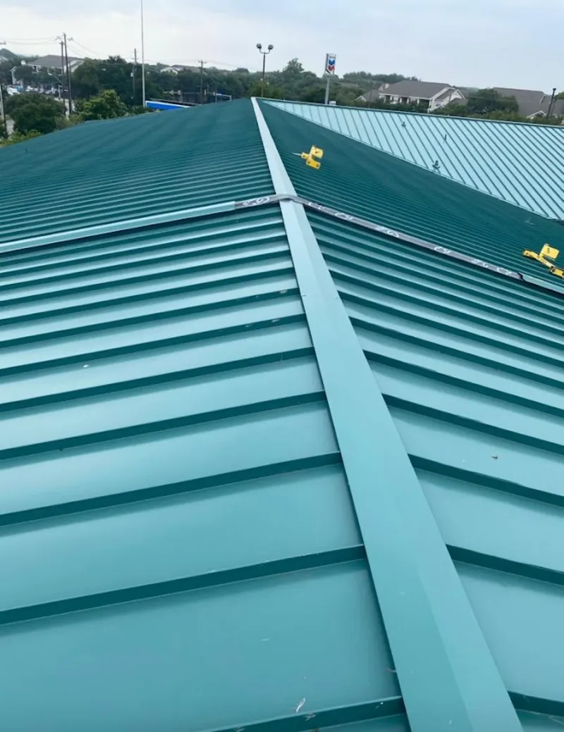Green commercial metal roof ridge and valley for Metal Roof Repair in Grant-Valkaria