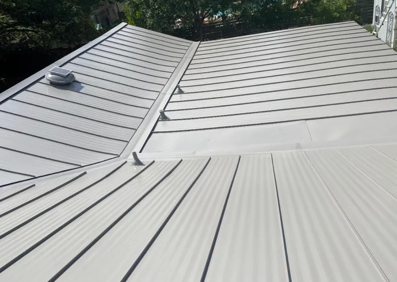 Solar attic fan installed on a metal roof for Roof Ventilation in Grant-Valkaria